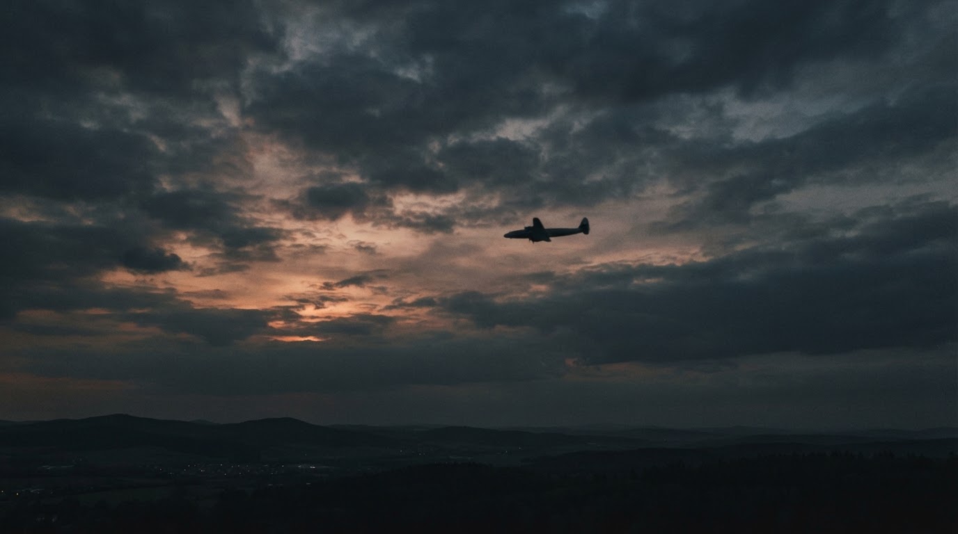 The hazy silhouette of an old passenger plane crossing an evening sky, sunset bleeding through the clouds (AI-generated image)