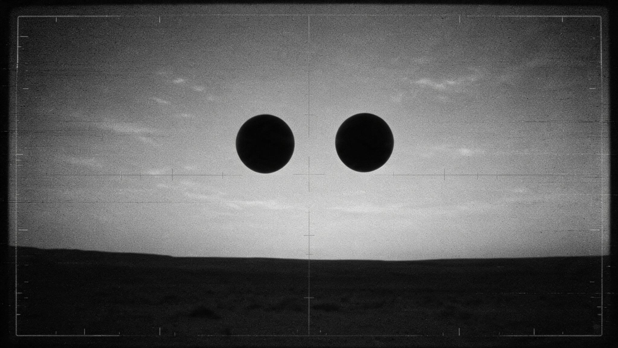 Handheld infrared view: two dark objects moving in parallel across the frame at matched speed. (AI-generated reconstruction of the described sensor capture)