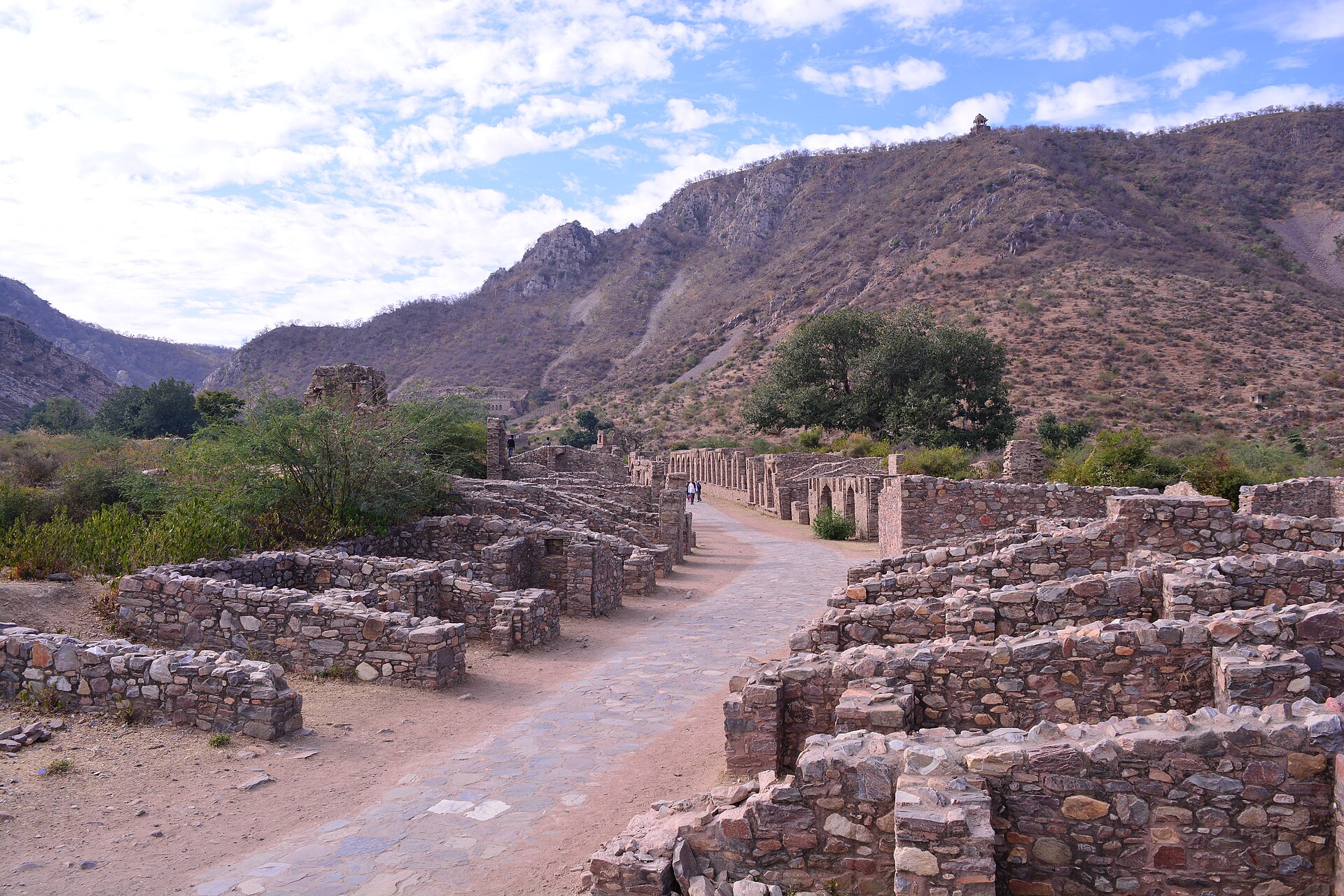 The foundations of Bhangarh's abandoned village spread out inside the walls, all that is left of the houses