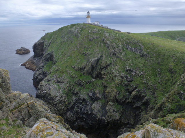 The lighthouse above the northern cliffs of Eilean Mor, rock walls dropping straight into the sea