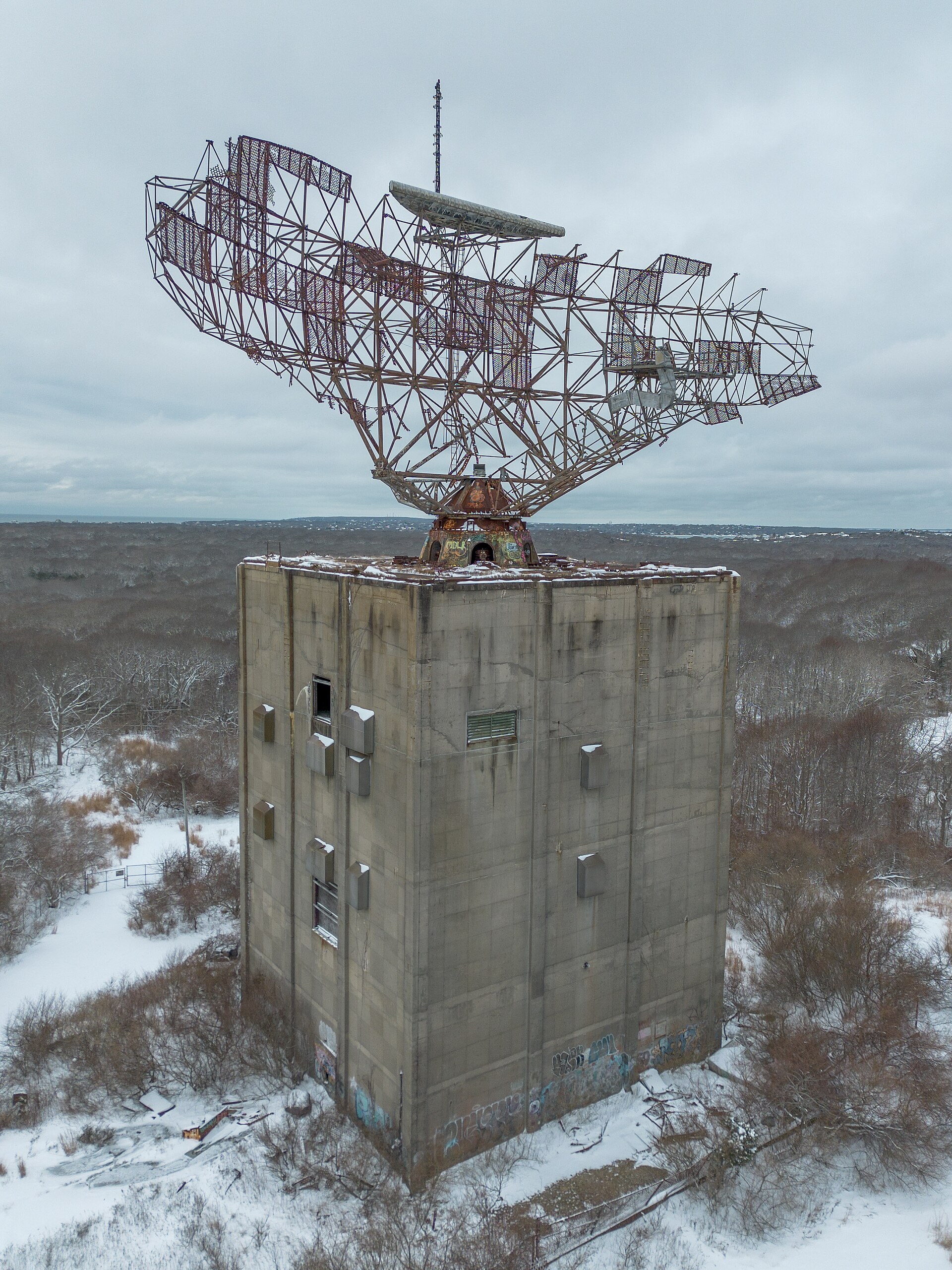 The radar antenna atop its concrete tower, seen looking straight up from below