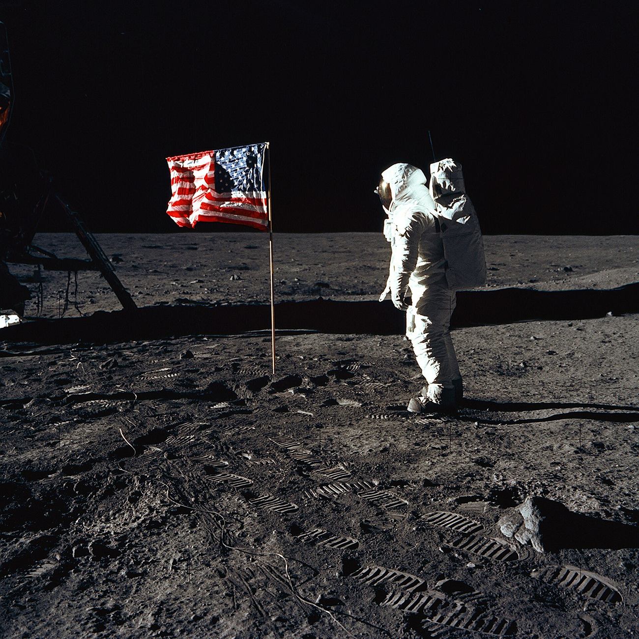 "The waving flag." A horizontal rod along the top held the flag open; with no air to damp it, the pole's motion kept it rippling. (NASA / Public domain)