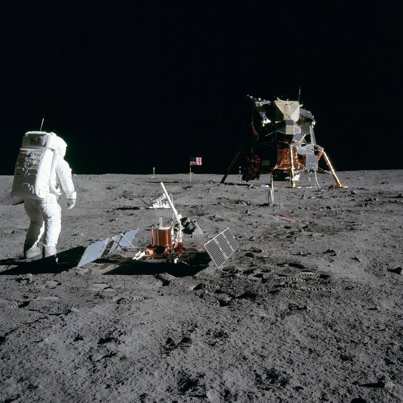 Aldrin looks back at Tranquility Base; the lunar module and the whole scene are mirrored in his visor. (NASA Neil A. Armstrong / Public domain)