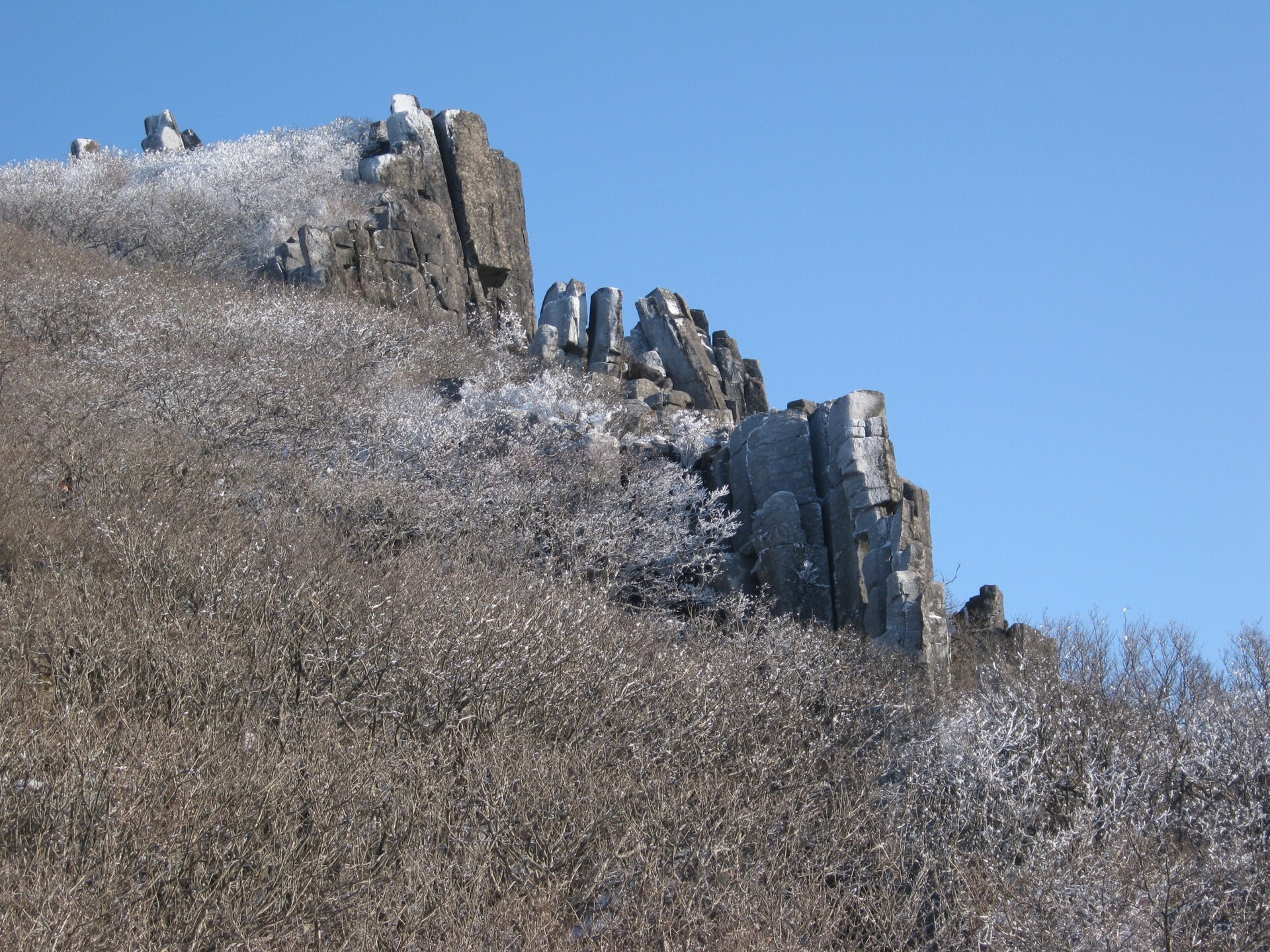 A trail and rocky ground on Mudeungsan — a present-day view of the area near the site