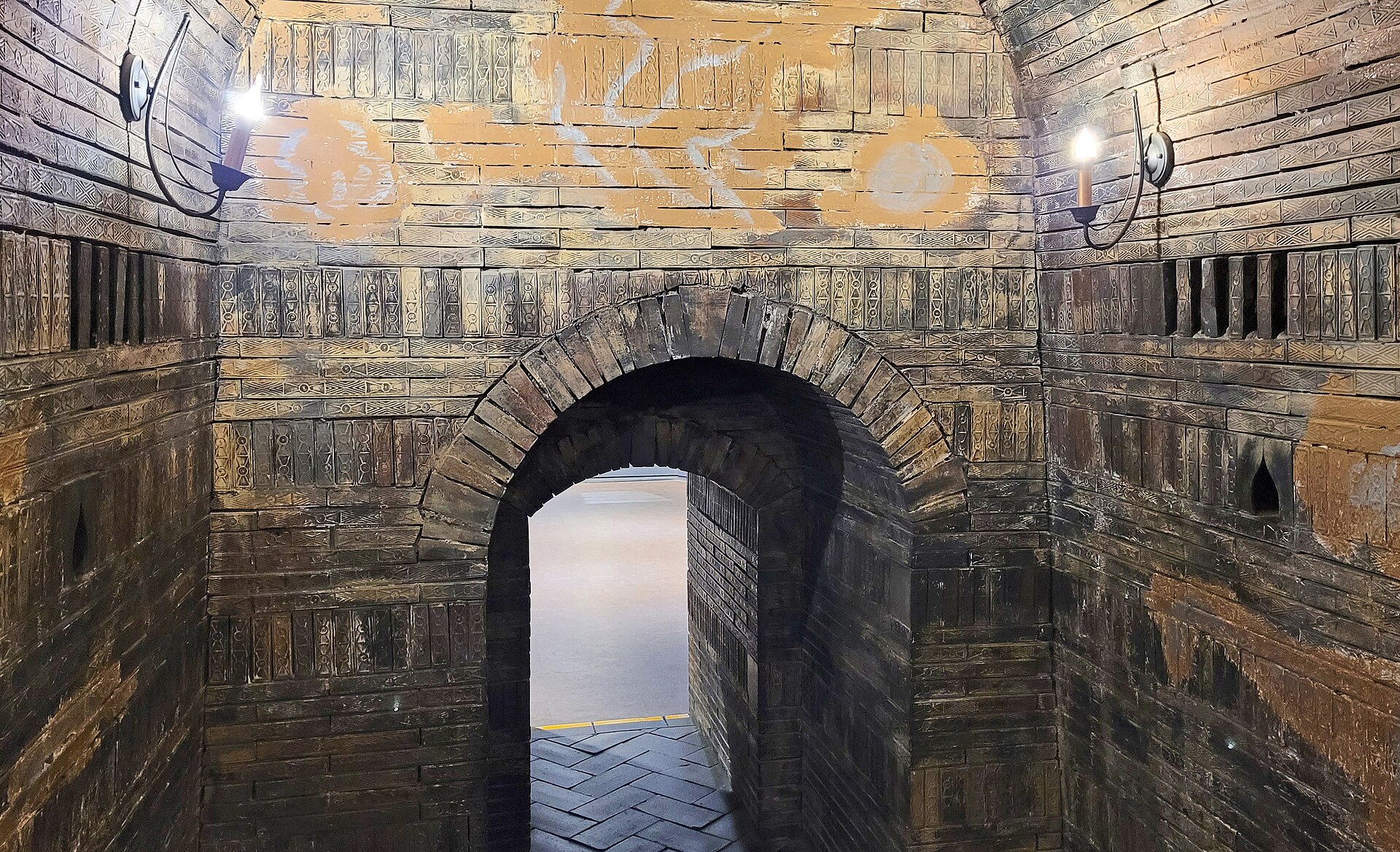The reconstructed interior of the Tomb of King Muryeong — the arched brick-built chamber of a Baekje brick tomb
